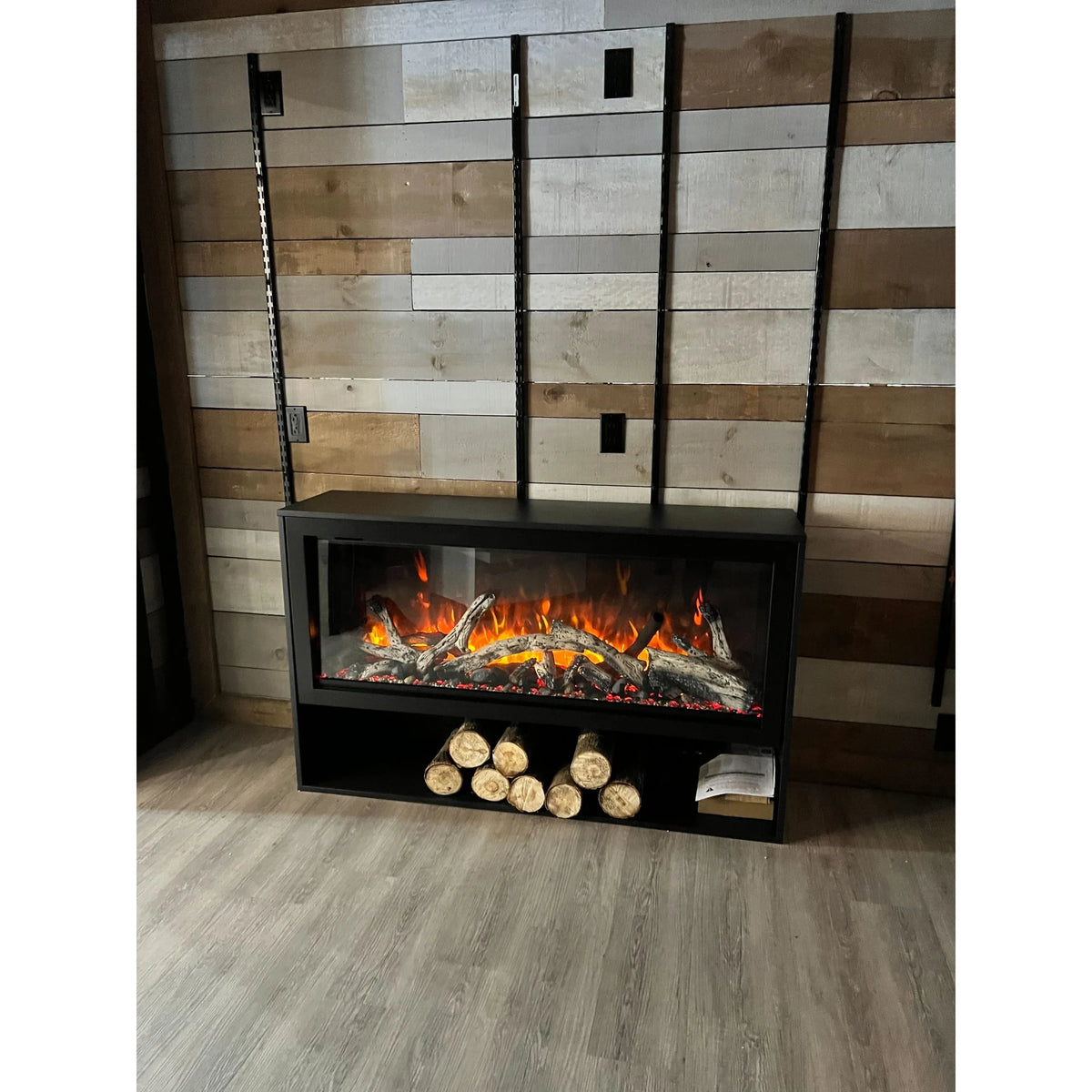 Amantii pedestal display shown with a fireplace, series view