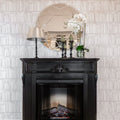 Built-in electric fireplace insert in a black mantel surround