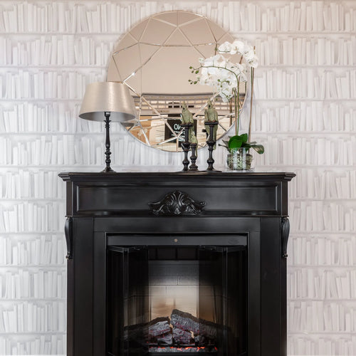 Built-in electric fireplace insert in a black mantel surround