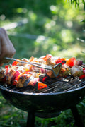 Grill cooking vegetable and meat skewers